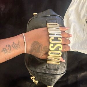 Black moschino bag.